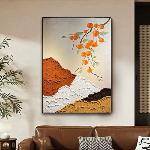 Textured sand painting with warm layered landscape and orange floral branch – framed modern artwork.